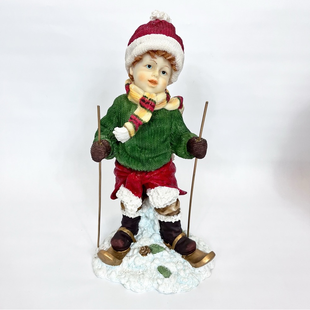 Direct International Christmas Figurine Boy With Skis Heavy Resin